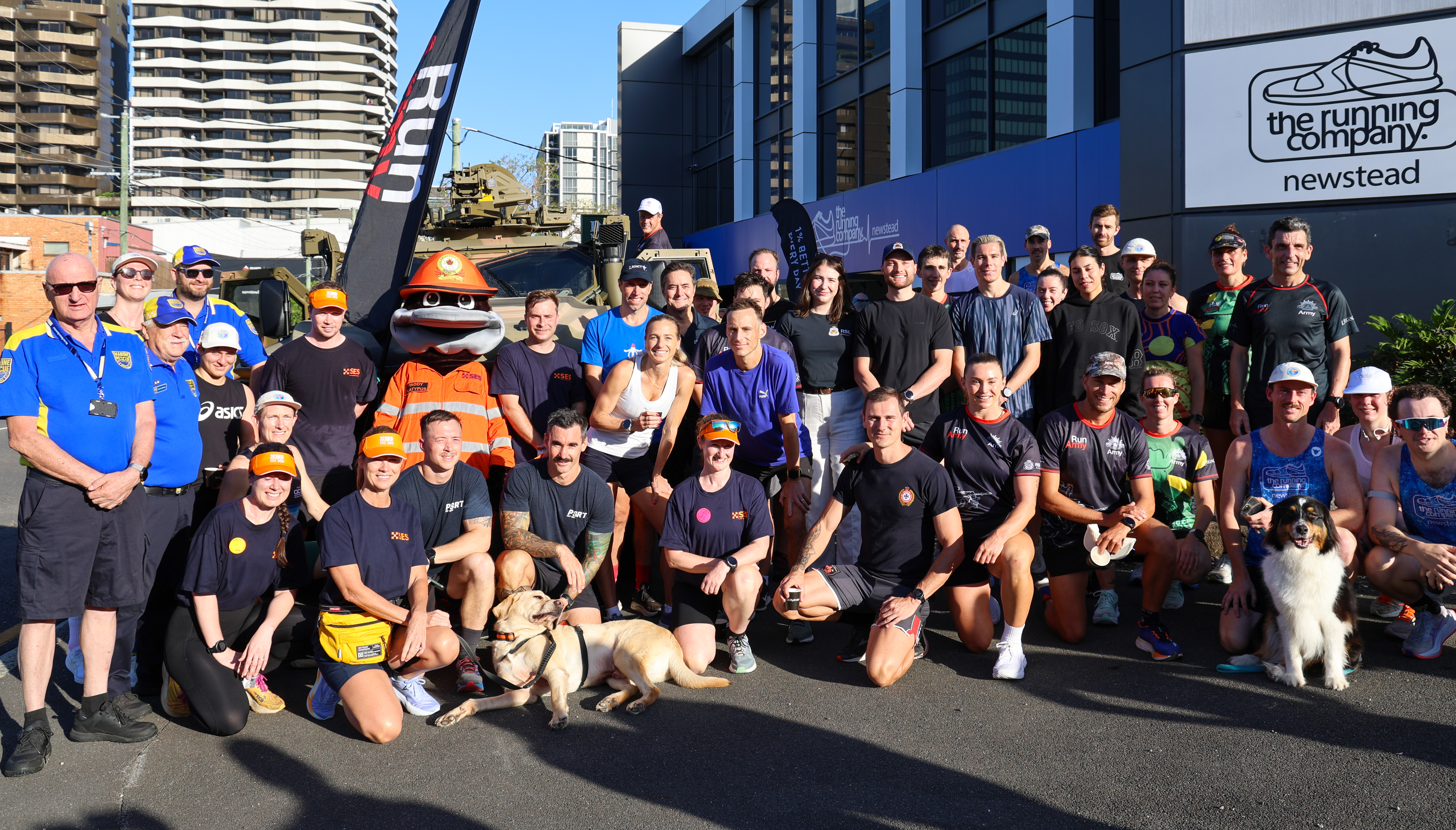 Volunteers and other participants in group posing for Run Army launch