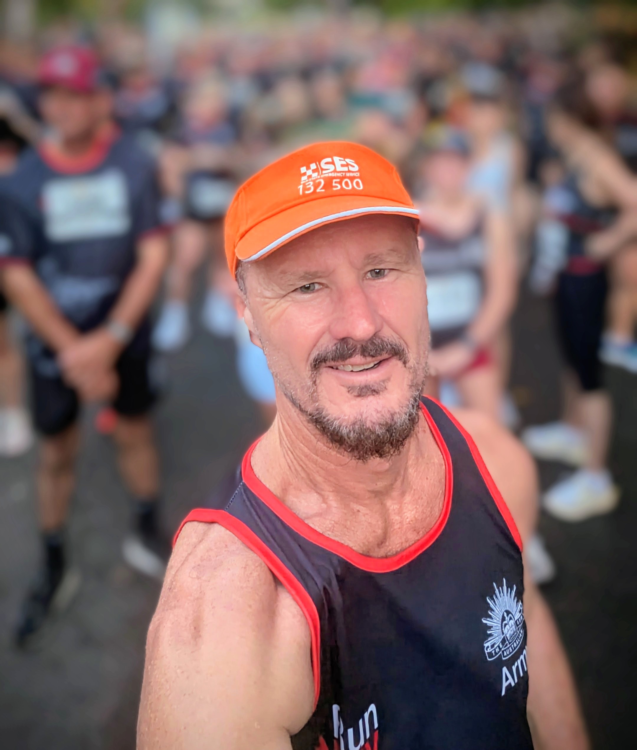 SES Volunteer selfie wearing SES running visor.