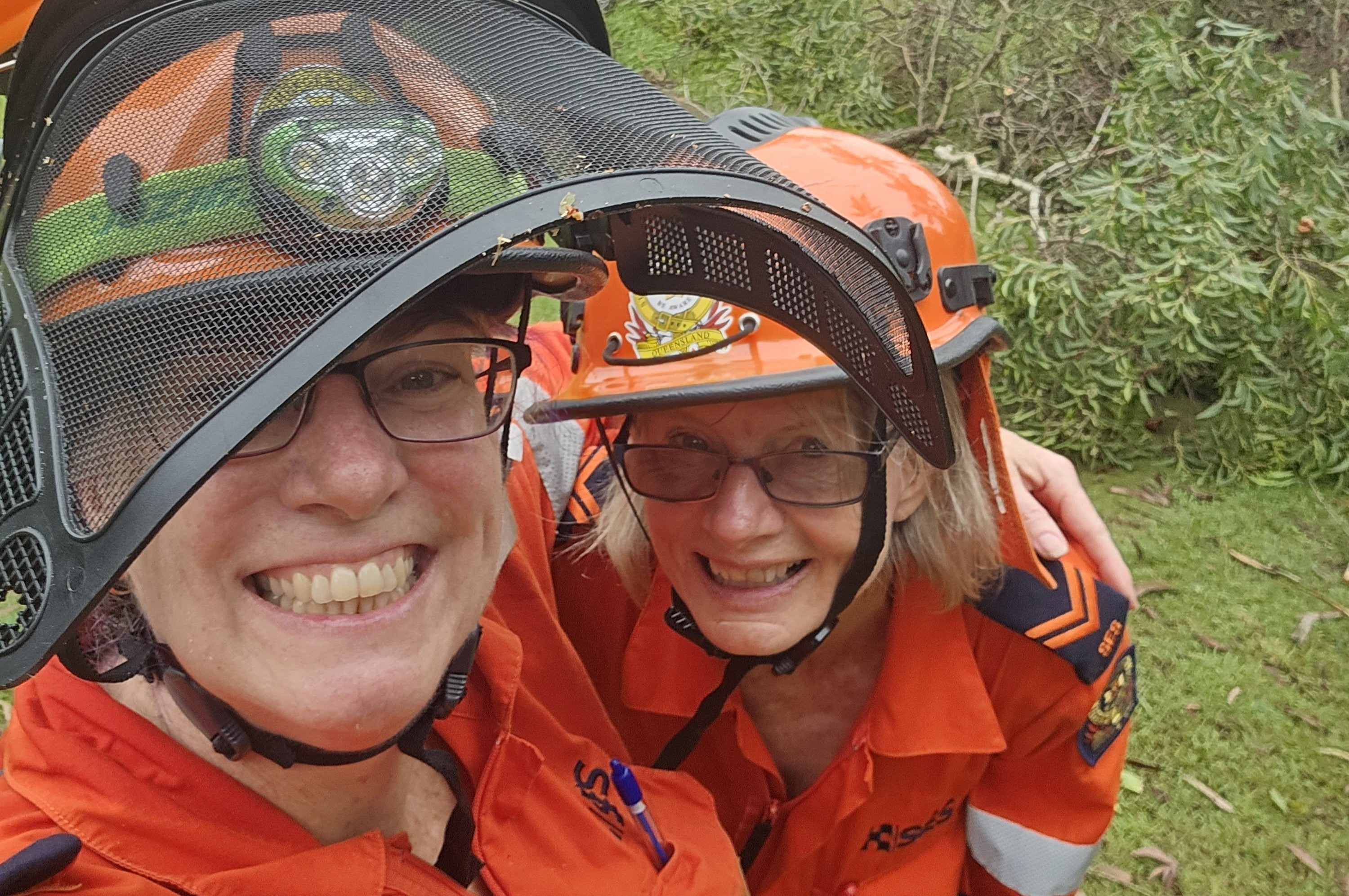 WOW image frame with two SES volunteers taking a selfie smiling.