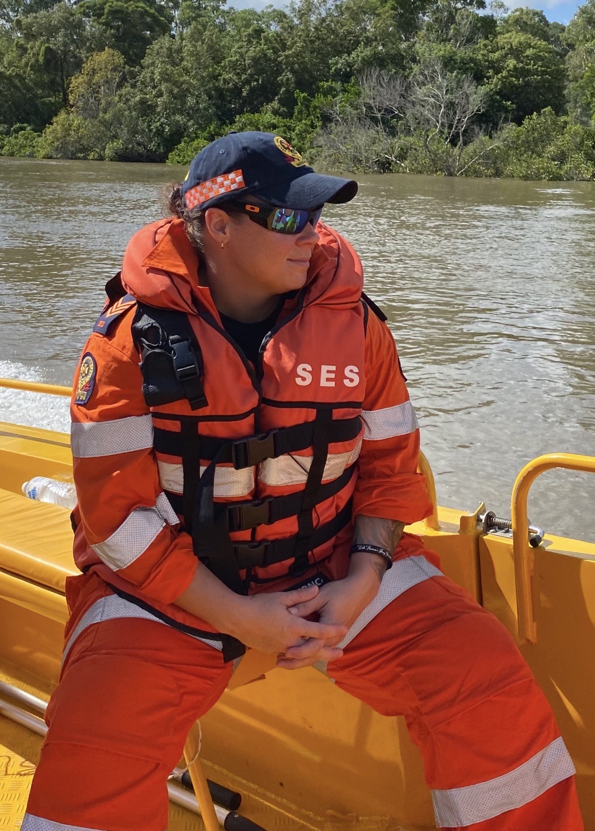 SES member Cindel sitting in flood boat.