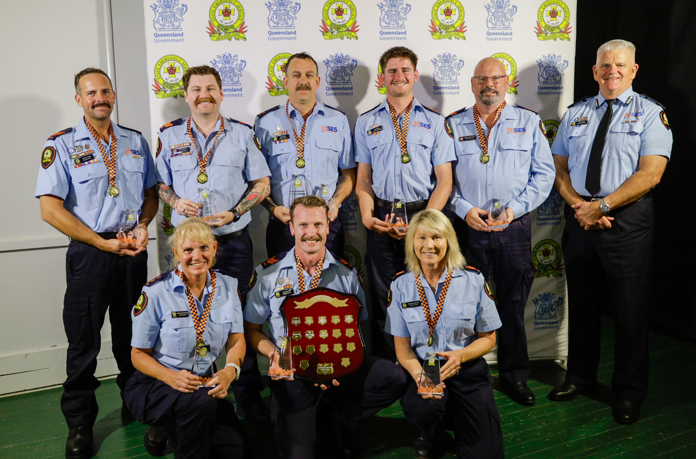 Queensland SES team standing together after receiving the winning award. award for the NDRC